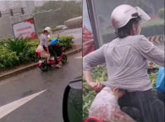 Trời mưa tầm tã, hành động của mẹ trẻ làm người qua đường ai cũng ngoái lại nhìn