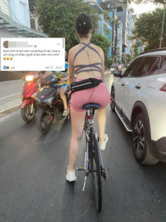 Người phụ nữ đạp xe mặc đồ bó sát, khoe trọn tấm lưng làm tắc cả đoạn đường hồ Tây